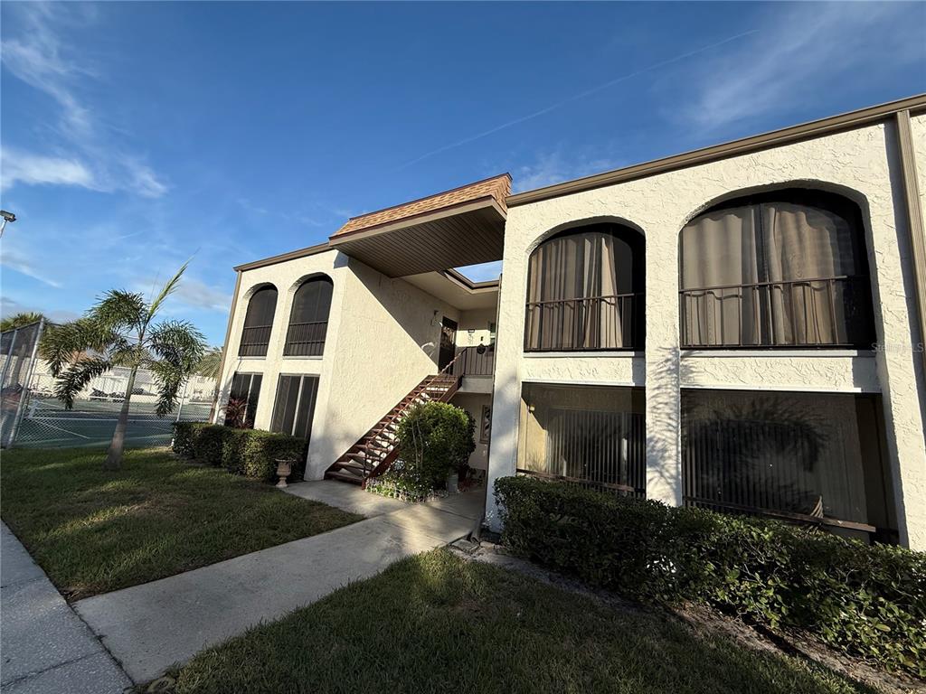 7701 Starkey Road, Unit 703 Seminole, FL 33777 - Photo 23 of 23 a front view of a house with a yard