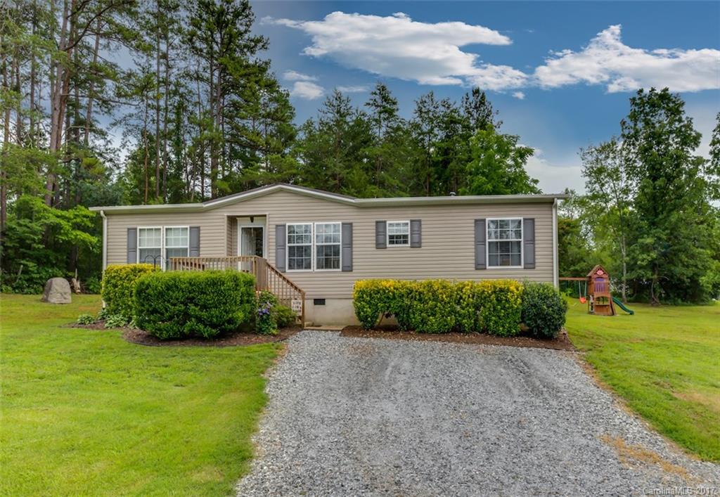 230 Cane Creek Road Rutherfordton, NC 28139 - Photo 2 of 18 a view of a house with a yard and potted plants