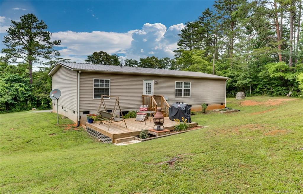 230 Cane Creek Road Rutherfordton, NC 28139 - Photo 16 of 18 a view of a house with backyard and sitting area