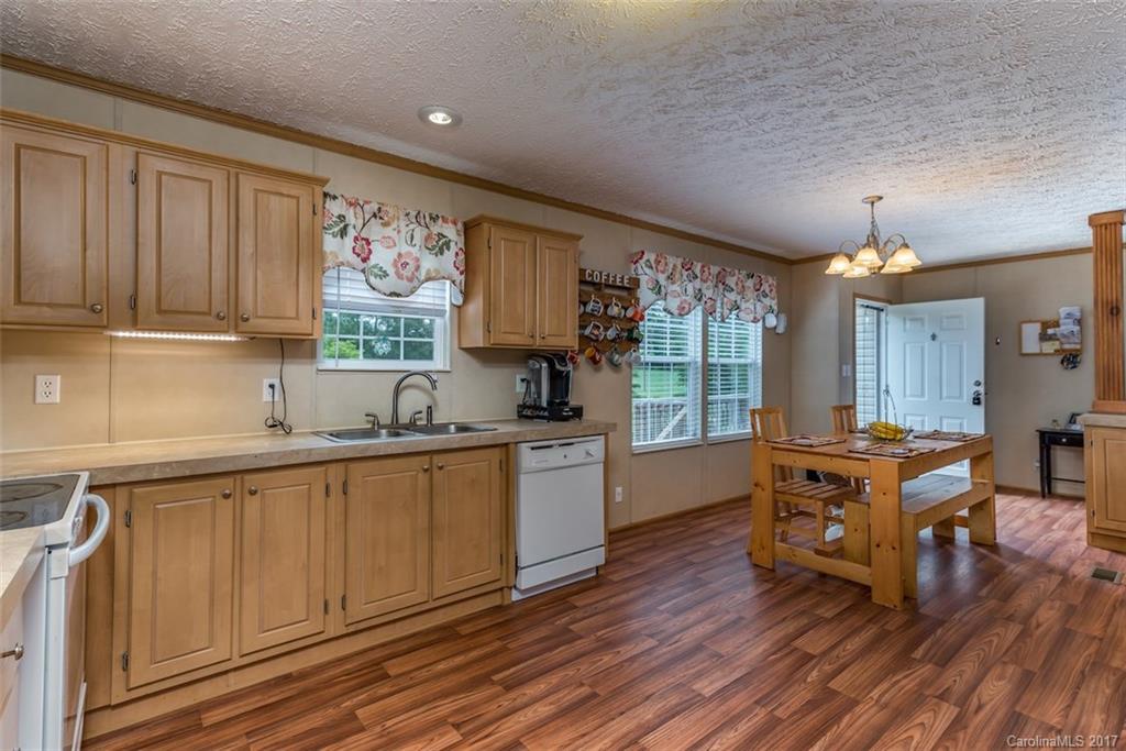 230 Cane Creek Road Rutherfordton, NC 28139 - Photo 5 of 18 a kitchen with a wooden floor and large window