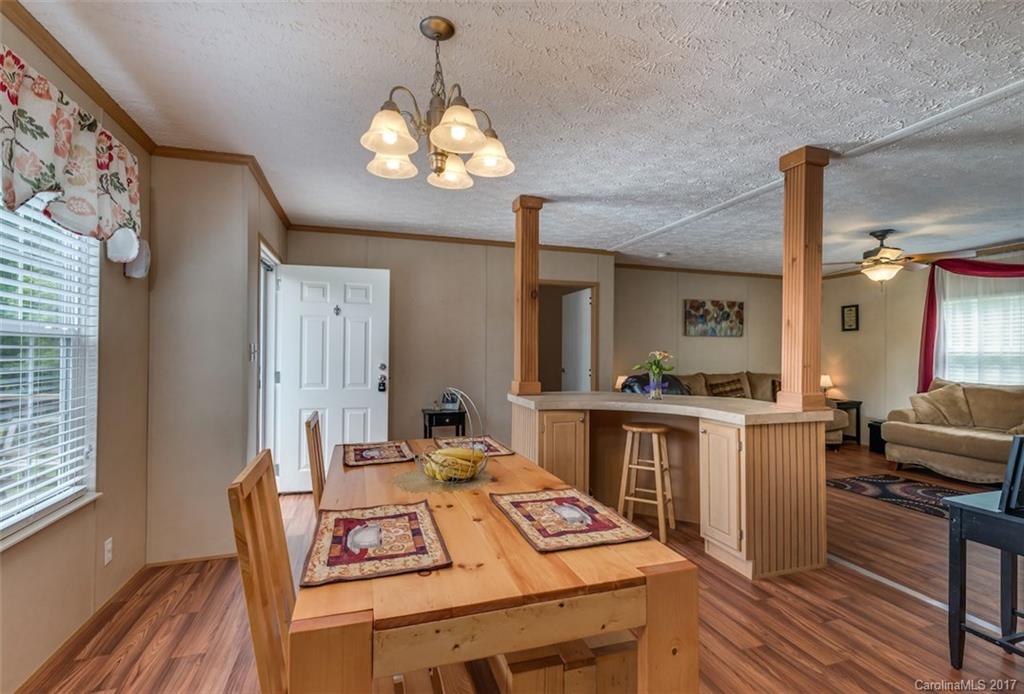 230 Cane Creek Road Rutherfordton, NC 28139 - Photo 6 of 18 a view of a dining room with furniture window and wooden floor