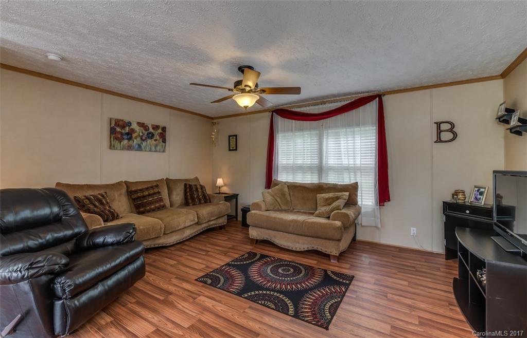 230 Cane Creek Road Rutherfordton, NC 28139 - Photo 7 of 18 a living room with furniture and a wooden floor