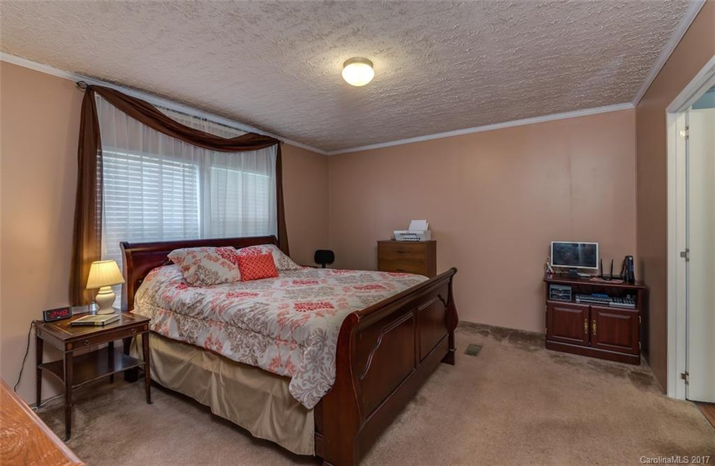 230 Cane Creek Road Rutherfordton, NC 28139 - Photo 9 of 18 a bedroom with a bed and a flat screen tv