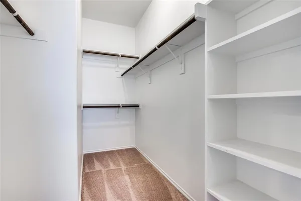 a view of an empty walk in closet
