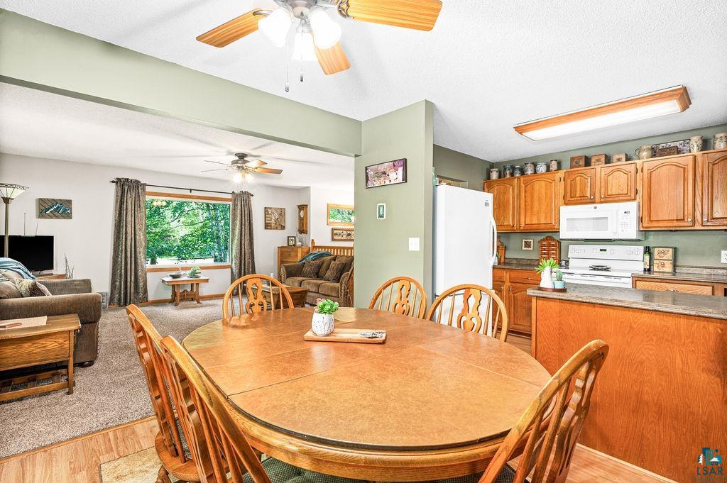 5279 Samuelson Road Duluth, MN 55811 - Photo 7 of 31 Dining space with ceiling fan and light colored carpet
