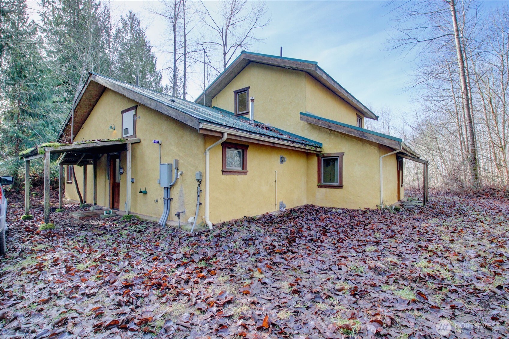 a house with trees in the background