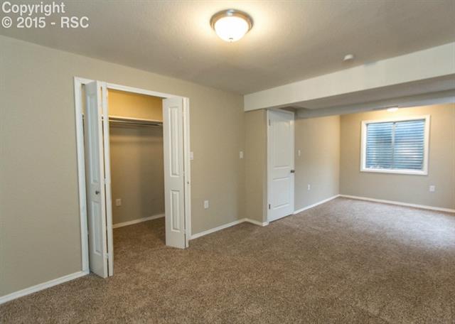 1730 Doherty Road Colorado Springs, CO 80916 - Photo 31 of 32 Another view of bedroom #3 highlighting the closet