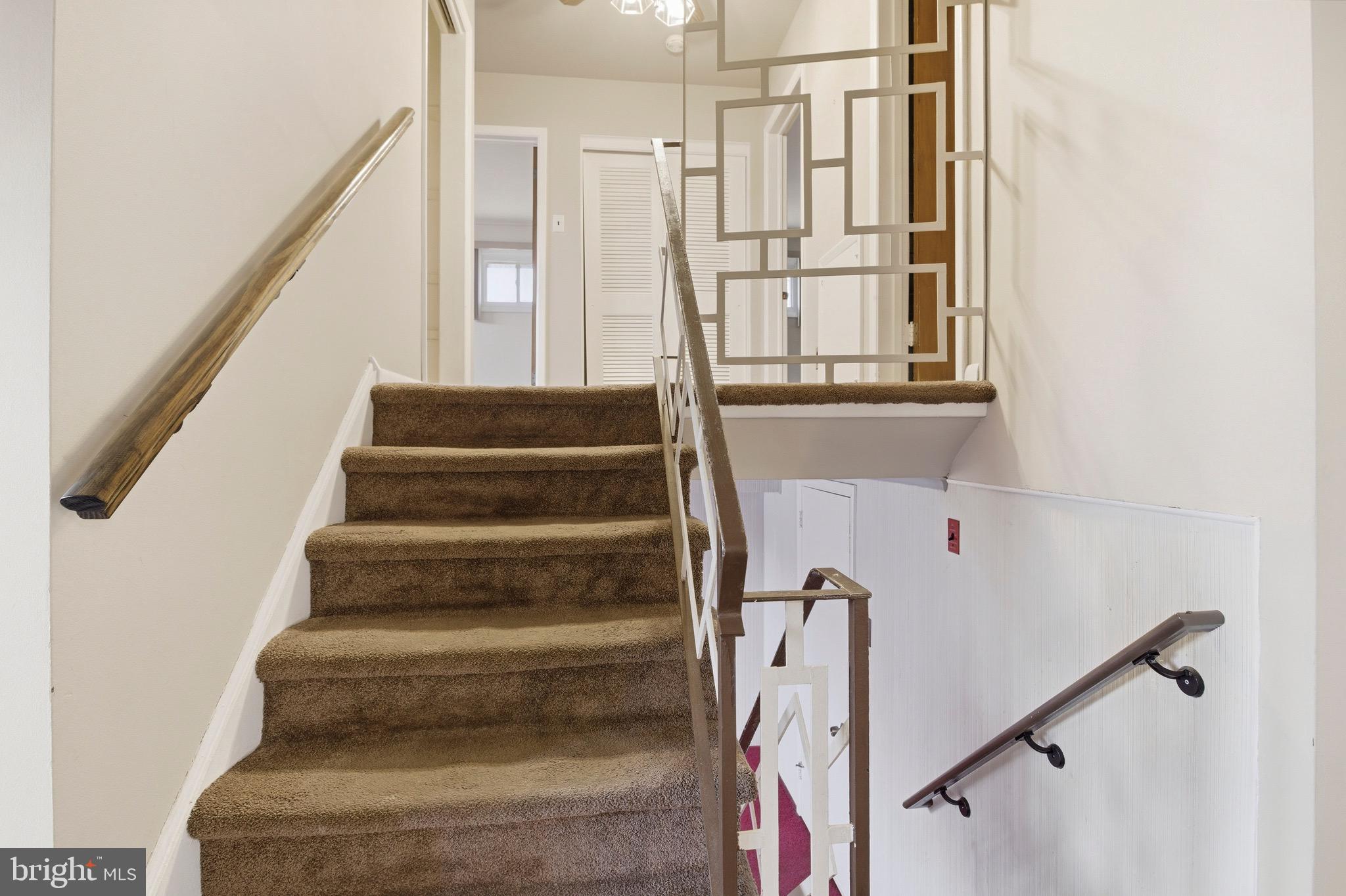 412 Foster Drive Springfield, PA 19064 - Photo 15 of 34 a view of staircase with white walls and a window