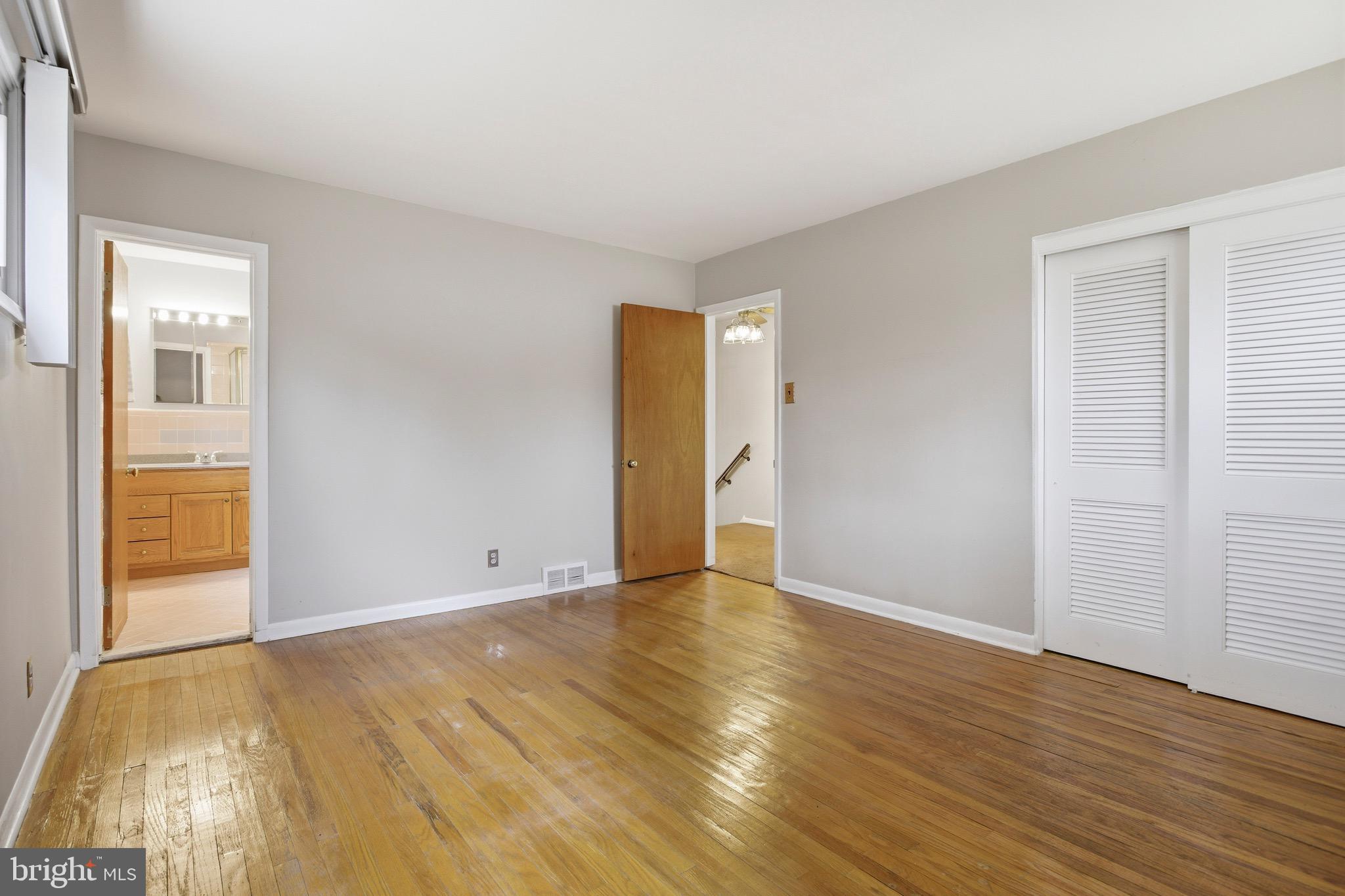 412 Foster Drive Springfield, PA 19064 - Photo 17 of 34 a view of an empty room with wooden floor