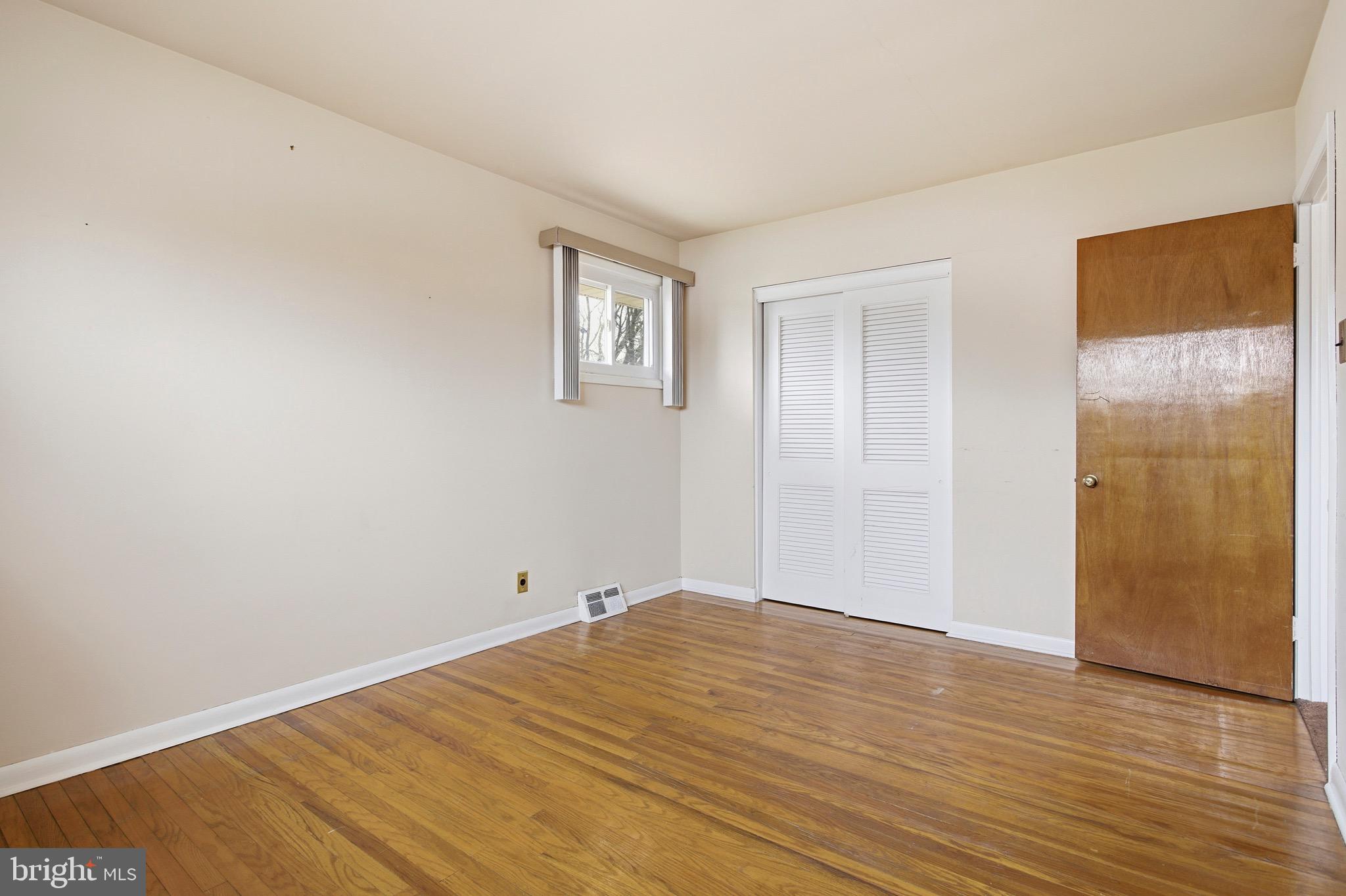 412 Foster Drive Springfield, PA 19064 - Photo 20 of 34 a view of empty room with wooden floor
