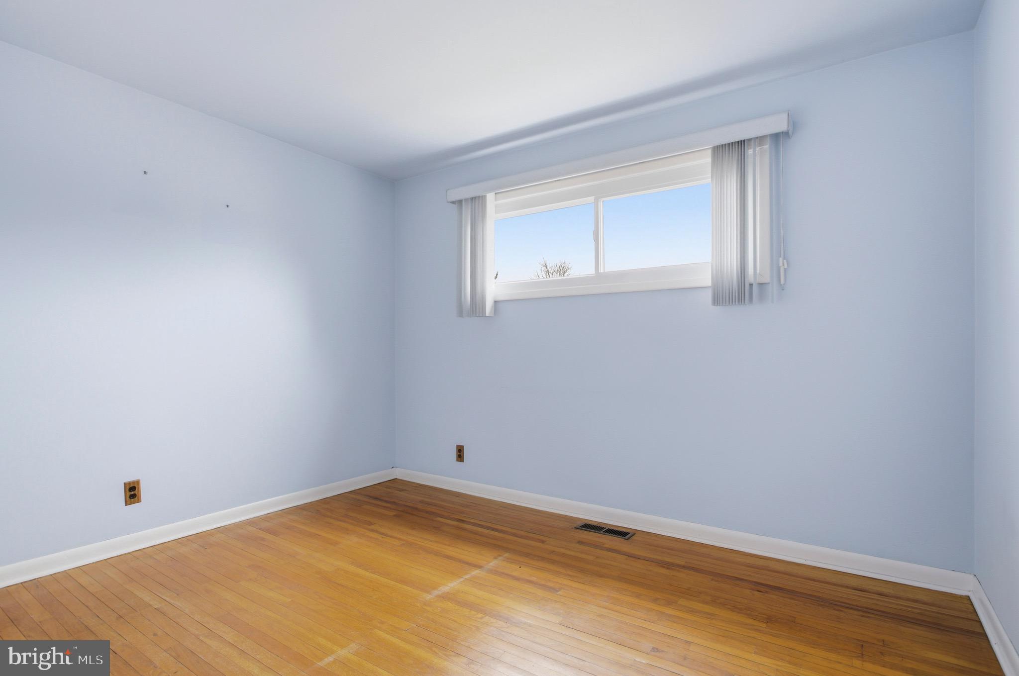 412 Foster Drive Springfield, PA 19064 - Photo 21 of 34 a view of empty room with wooden floor