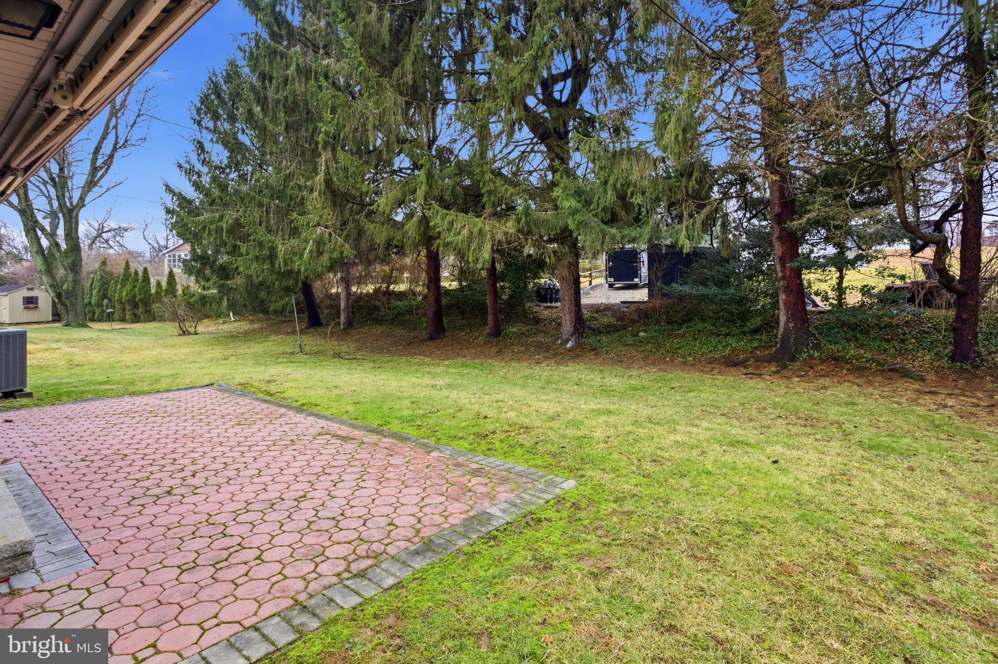 412 Foster Drive Springfield, PA 19064 - Photo 31 of 34 a small garden covered with tall trees