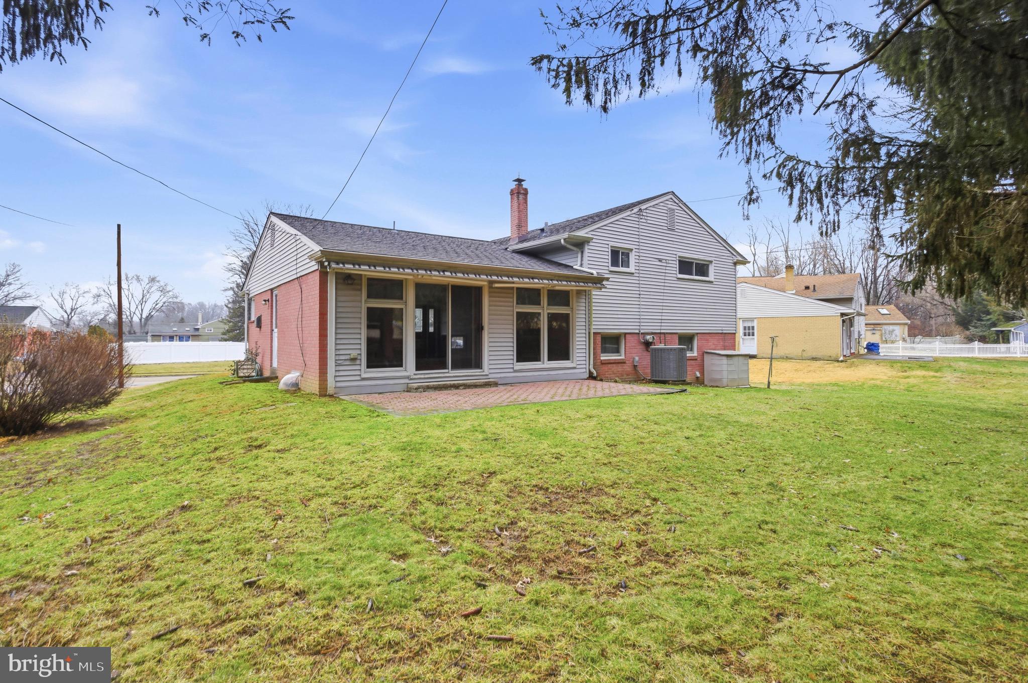 412 Foster Drive Springfield, PA 19064 - Photo 32 of 34 a view of a house with backyard porch and garden