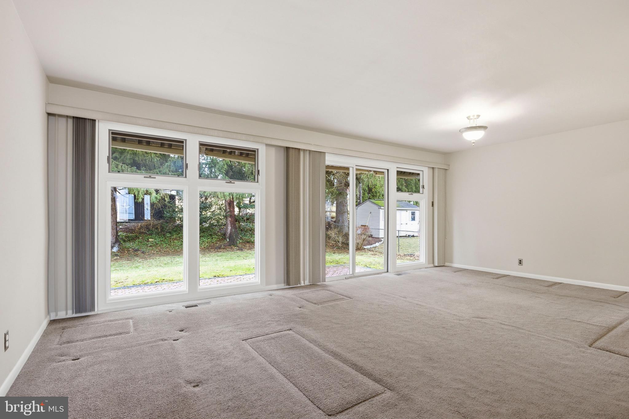 412 Foster Drive Springfield, PA 19064 - Photo 6 of 34 wooden floor and window in an empty room