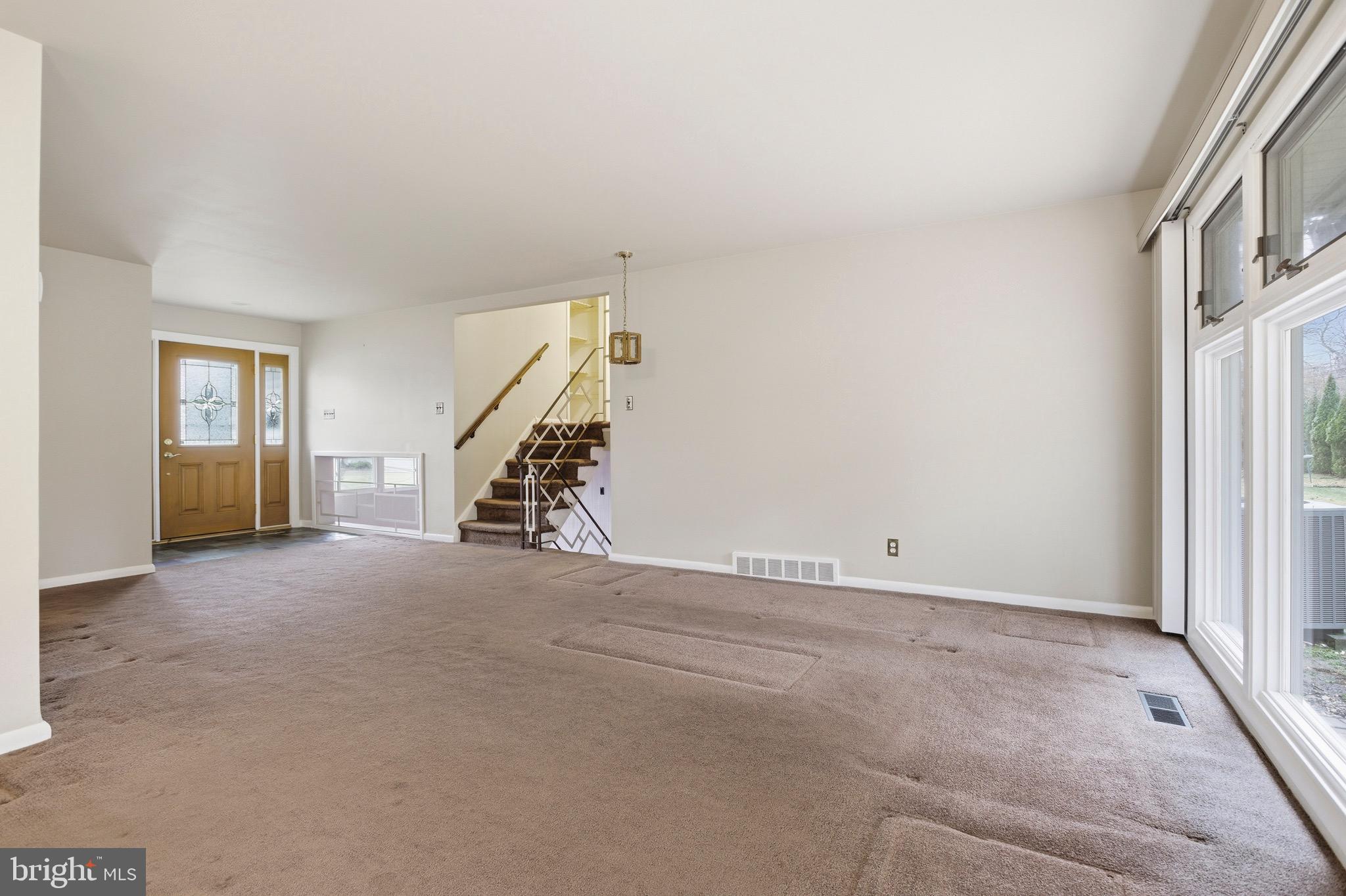 412 Foster Drive Springfield, PA 19064 - Photo 9 of 34 a view of an empty room with stairs