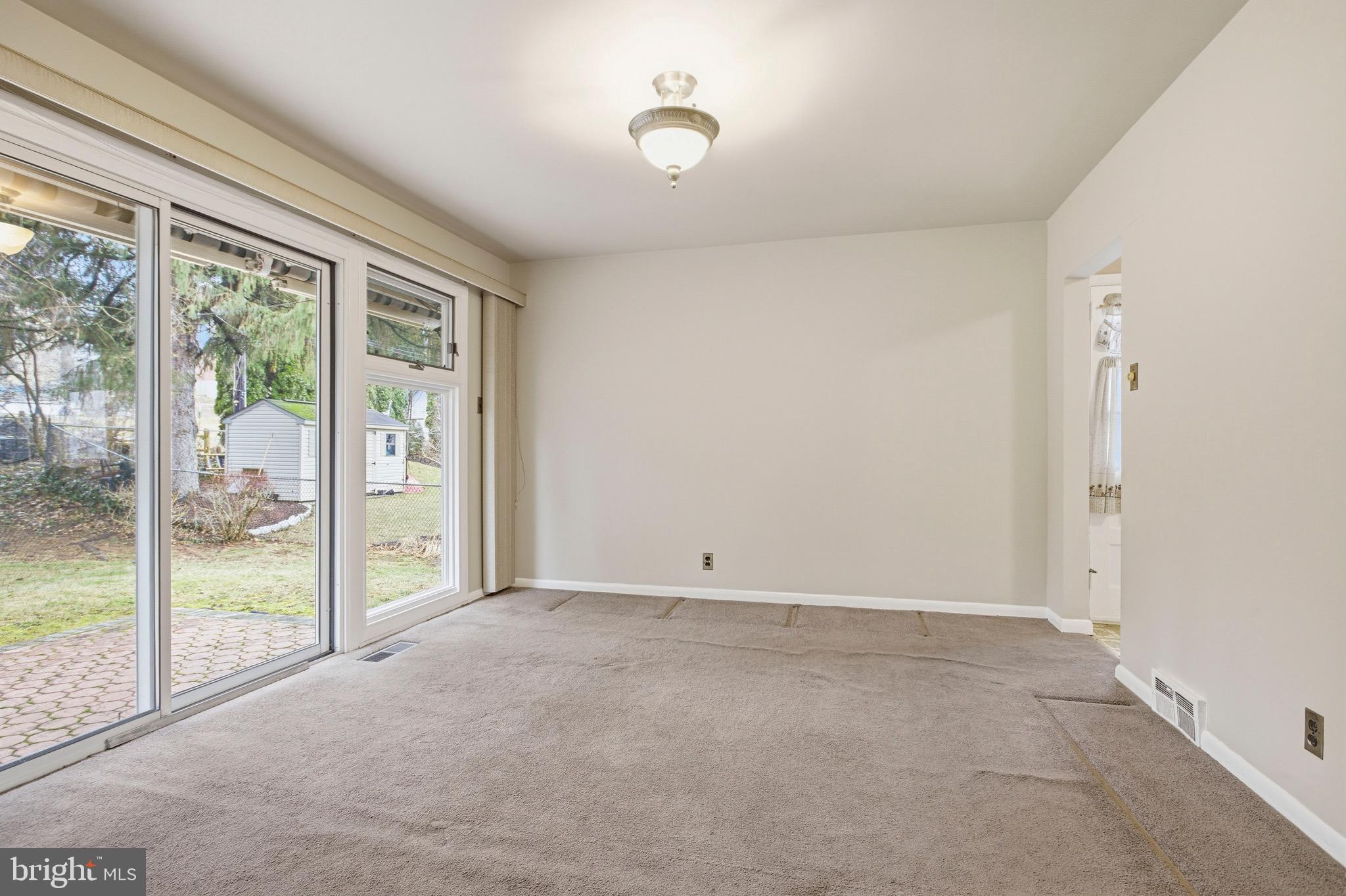 412 Foster Drive Springfield, PA 19064 - Photo 10 of 34 a view of an empty room with glass door