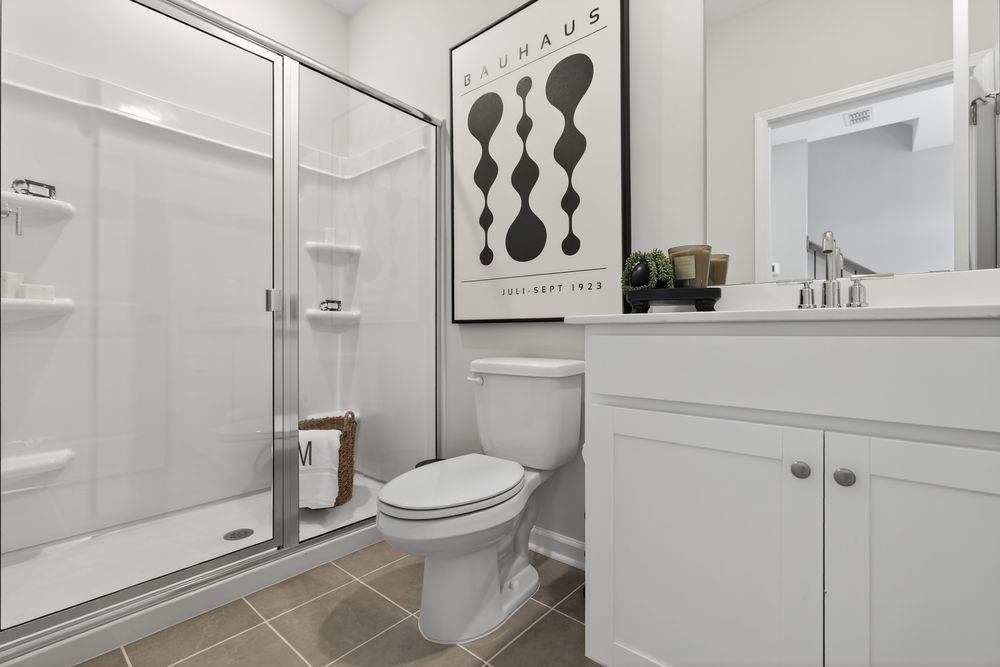 747 Meadow Ridge Lane Cumming, GA 30040 - Photo 25 of 41 a bathroom with a toilet and a shower