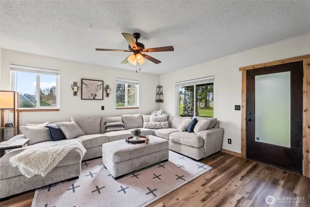 a living room with furniture and a window