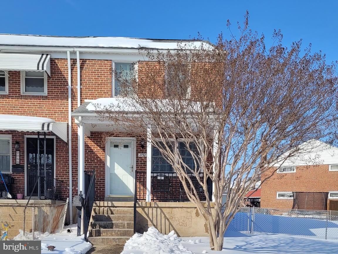 a view of a house with a tree