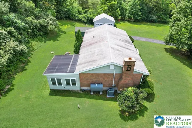 a aerial view of a house with garden