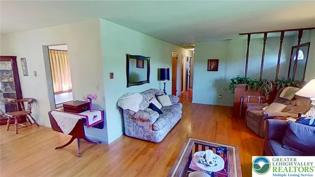 a bathroom with a toilet and shower curtain