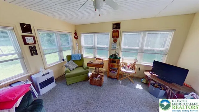 a bedroom with furniture and a window