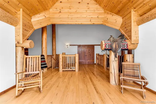 a view of entryway with wooden floor and fence