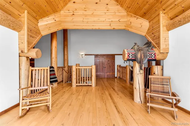 a view of entryway with wooden floor and fence