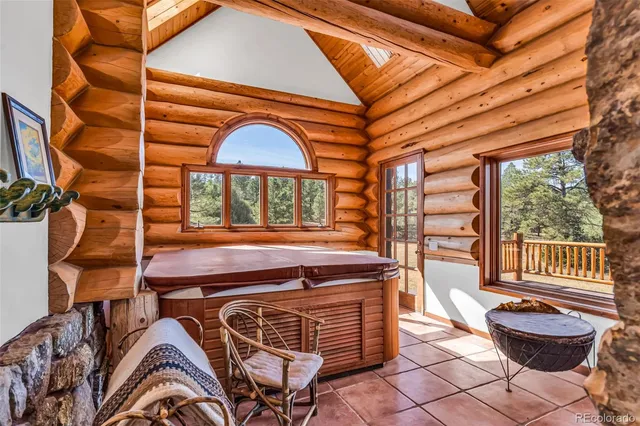 a view of a chairs and a table in the patio