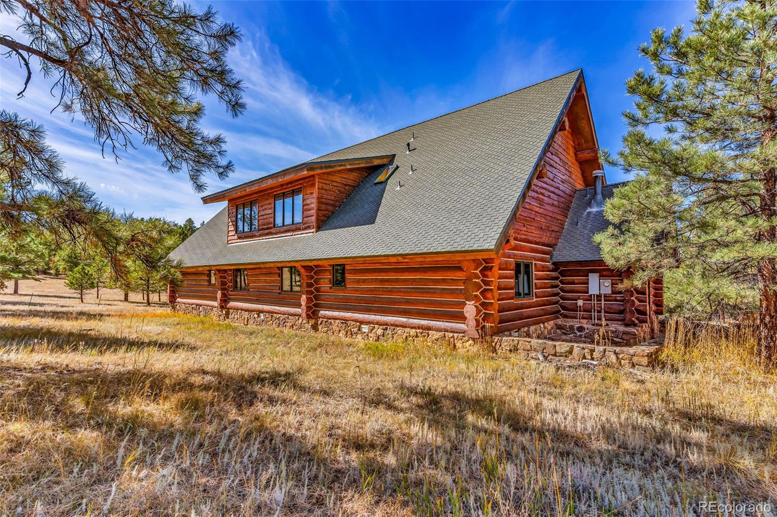 23100 Spirit Mountain Road Aguilar, CO 81020 - Photo 4 of 41 a backyard of a house with table and chairs