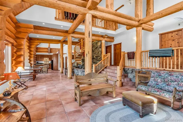 a outdoor space with patio the couches and a dining table with the couches and potted plants with sky view