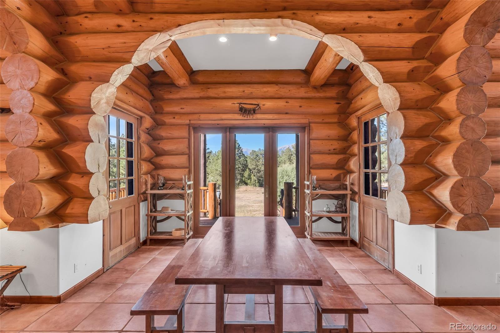 23100 Spirit Mountain Road Aguilar, CO 81020 - Photo 10 of 41 a dining room with a wooden table and chairs
