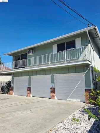 a front view of a house with a garage
