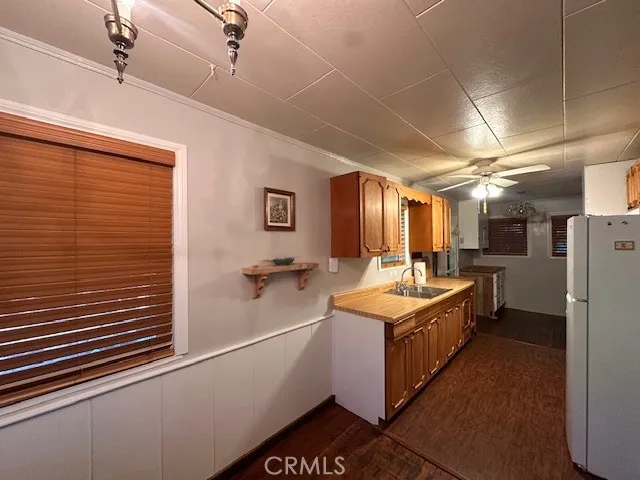 a kitchen with stainless steel appliances granite countertop a stove and a refrigerator