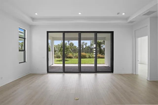 a view of an empty room with windows