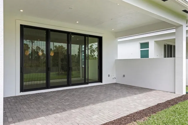 a view of a building and trees in the background