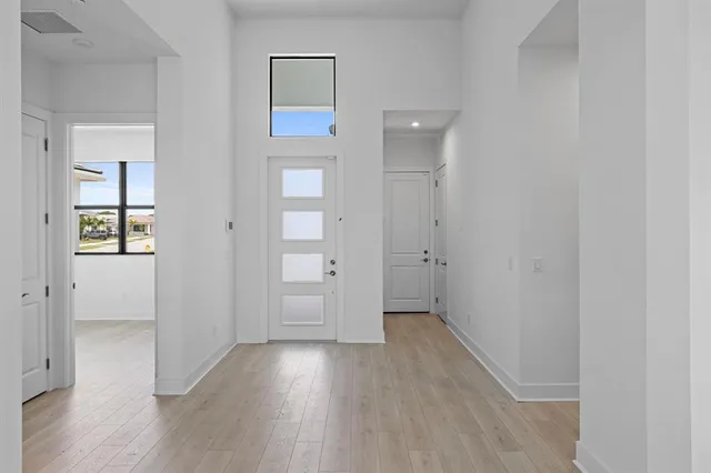 an empty room with wooden floor and closet