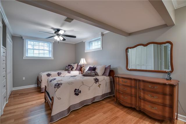 968 Sneed Road West Franklin, TN 37069 - Photo 16 of 20 Bedroom #4 with built-in drawers and bamboo floors is very large. It has it's own sitting area. (Pictured in the virtual tour).