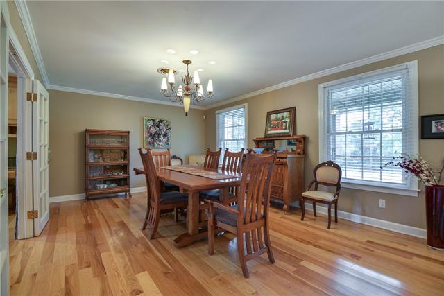 968 Sneed Road West Franklin, TN 37069 - Photo 2 of 20 This large dining room features hickory hardwood floors, crown molding and updated lighting. With French doors to the kitchen, this is the perfect room for a formal dinner party or family gathering.
