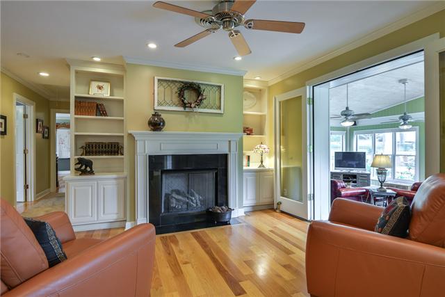 968 Sneed Road West Franklin, TN 37069 - Photo 4 of 20 Enjoy sitting by the fire in this den or keeping room. Adjacent to the kitchen, the glow of the fire can also be enjoyed by the owner as they prepare a meal. Fireplace has gas logs, with built-in bookcases and cabinets surrounding the mantle piece.