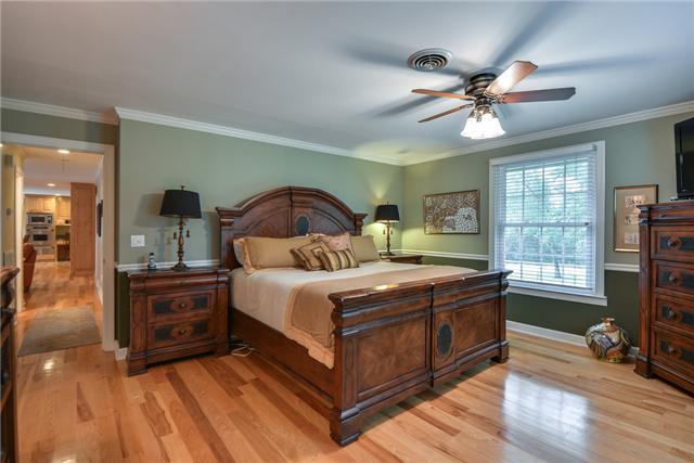 968 Sneed Road West Franklin, TN 37069 - Photo 7 of 20 Located on the main floor, the master bedroom features hickory flooring, chair rail, ceiling fan and crown molding. With it's own bathroom and large walk-in closet, this is the perfect owner's retreat.