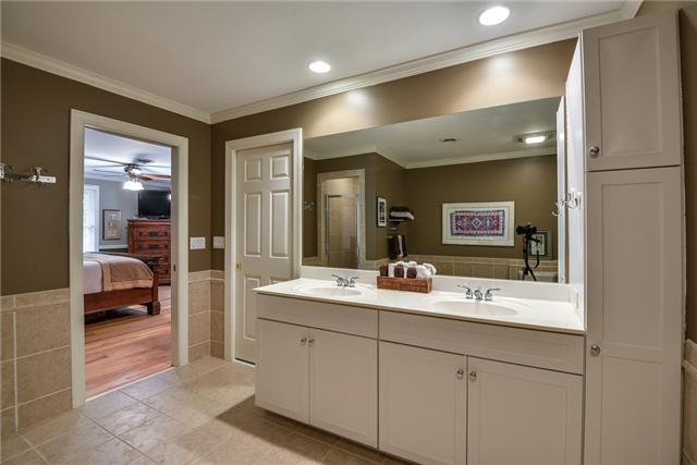 968 Sneed Road West Franklin, TN 37069 - Photo 8 of 20 For convenience, the master bathroom has double vanity sinks. New tile, hardware, and recessed lighting give it an updated contemporary look. Also included are a linen closet, separate shower, whirlpool tub, & a huge walk-in closet with organizers.
