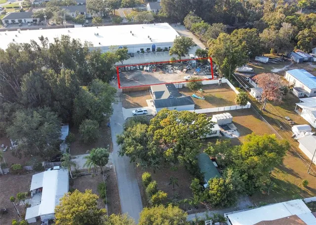 an aerial view of multiple houses with yard