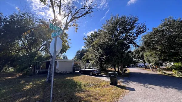 an aerial view of multiple houses with yard