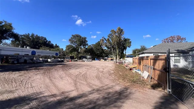 a view of a backyard with sitting area