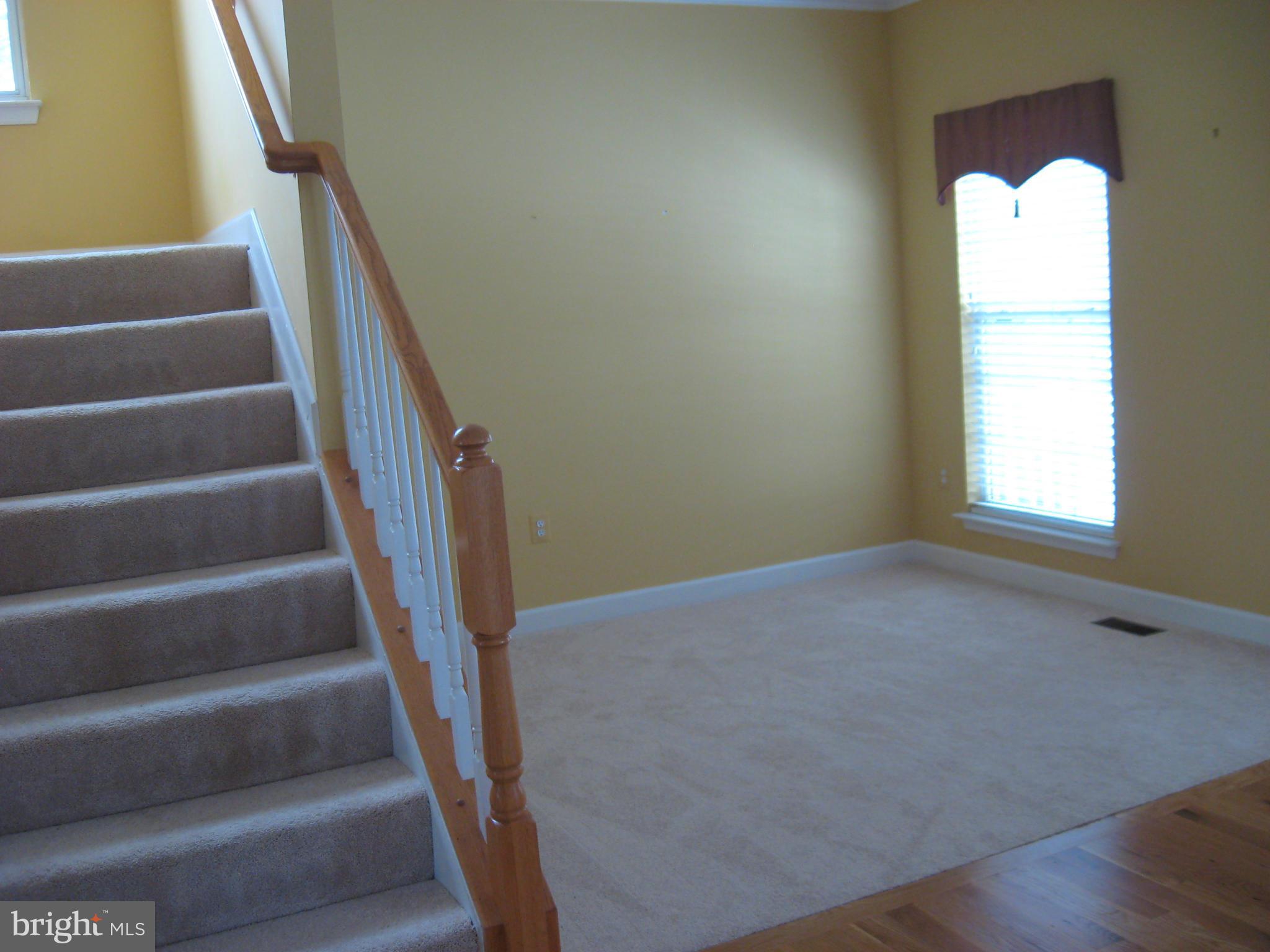8822 Mapleville Road Mount Airy, MD 21771 - Photo 8 of 27 a view of an empty room with stairs