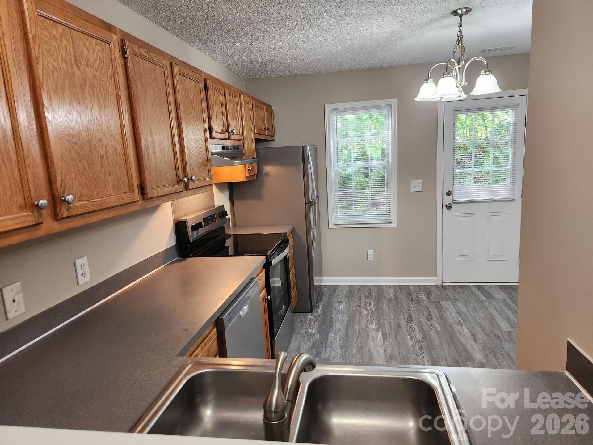159 Pounds Avenue Southwest Concord, NC 28025 - Photo 3 of 10 a room with a couch and a window