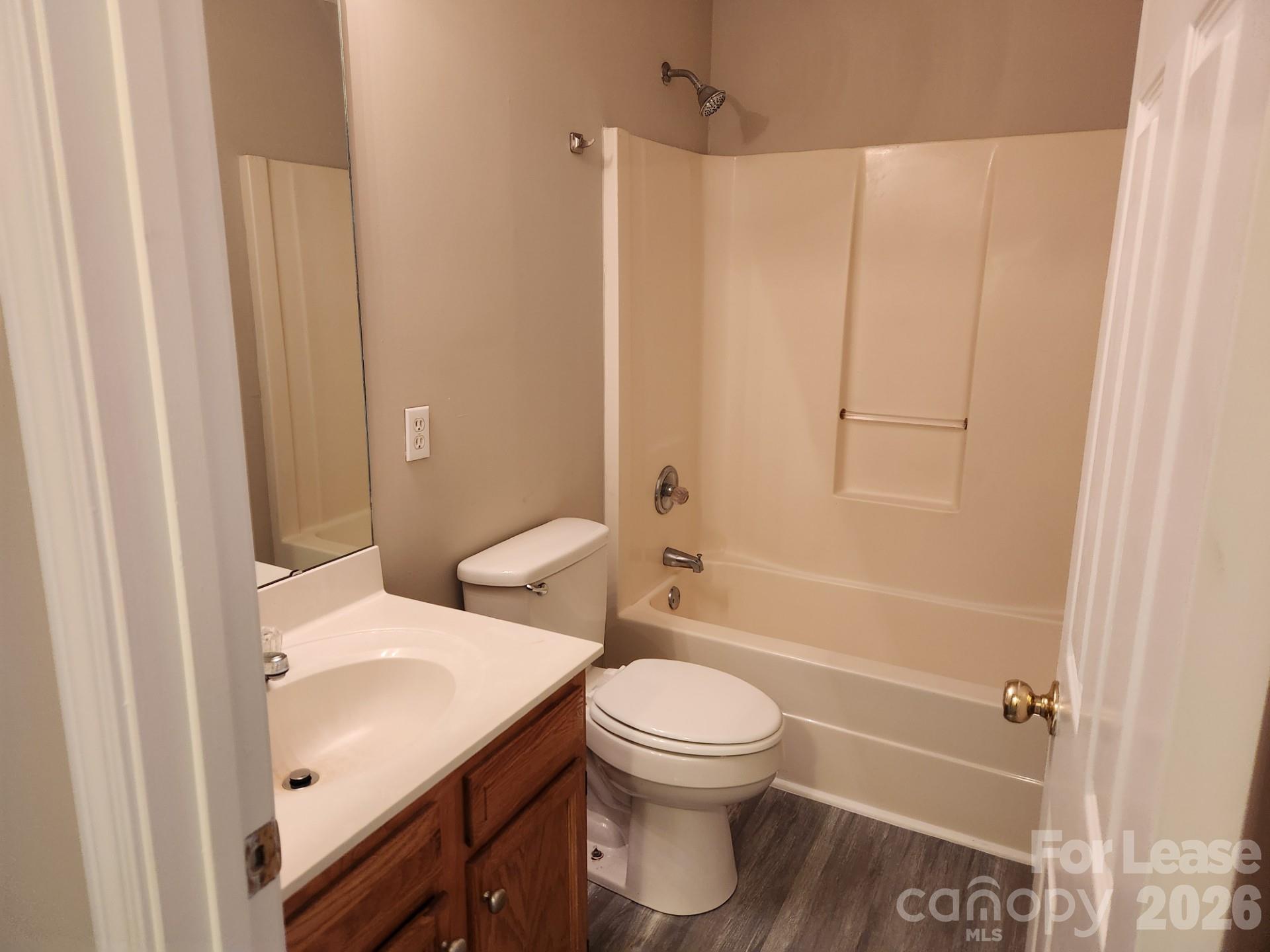 159 Pounds Avenue Southwest Concord, NC 28025 - Photo 6 of 10 a bathroom with a sink a toilet and shower