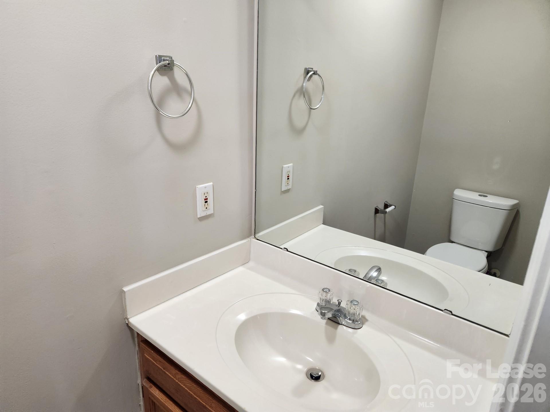 159 Pounds Avenue Southwest Concord, NC 28025 - Photo 10 of 10 a bathroom with a sink and a mirror