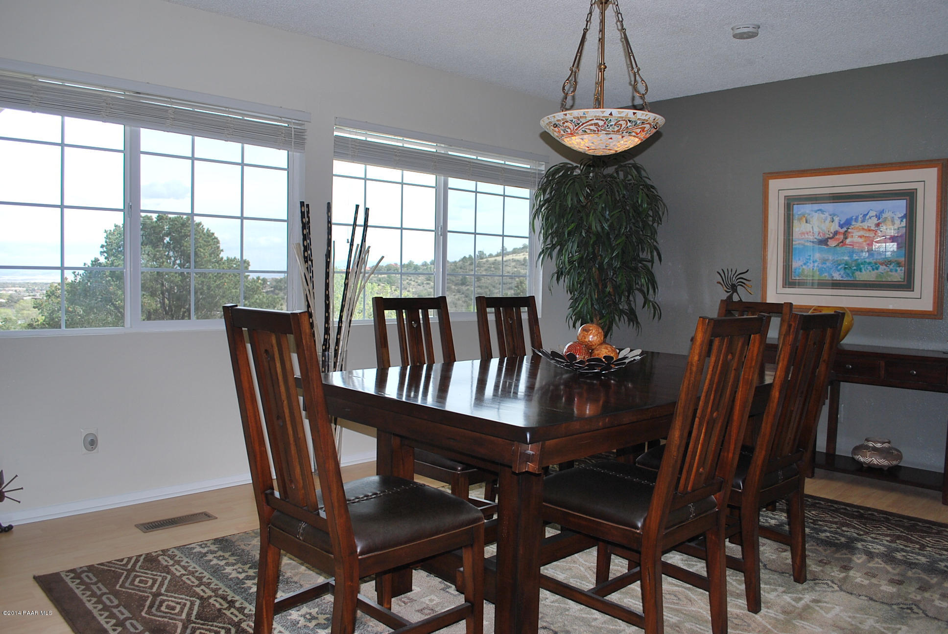 2701 Ridge Road Prescott, AZ 86301 - Photo 17 of 39 a view of a dining room with furniture wooden floor and chandelier